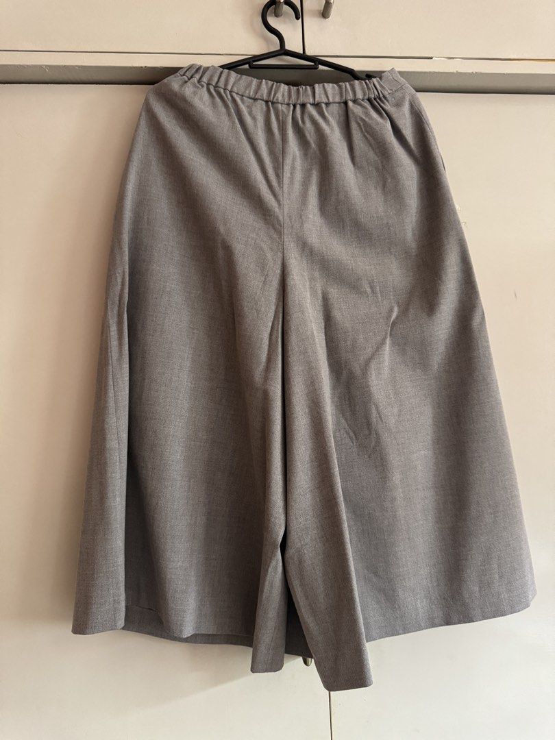 Grey Wide Leg Culottes Elastic Waist (Category: Skirts) located in Taytay. Submitted by darkswan016 (Listing ID 1470831184, Image 2). Description: - Color: Grey - Style: Wide leg culottes / Mid-length - Waist: Elastic waistband in the back for an easy, comfortable fit - Details: Pleated front with functional side pockets - Material: Structured fabric that holds its shape nicely - Versatility: Great for casual days or office wear.