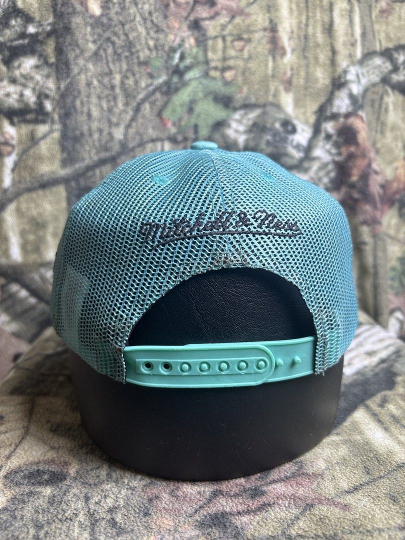 Grizzlies Trucker Cap (Category: Caps & Hats) located in Manila. Submitted by josh2295 (Listing ID 1470755737, Image 3). Description: teal and black Mitchell & Ness Vancouver Grizzlies trucker snapback cap featuring an embroidered script team logo.
