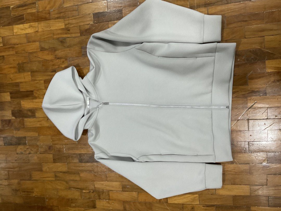GU Light Grey Zip-Up Hoodie Size S (Category: Coats, Jackets and Outerwear) located in Manila. Submitted by bnyonyo (Listing ID 1470797363, Image 1). Description: - Brand: GU - Color: Light grey - Size: S (tag attached near collar) - Material: Smooth cotton blend - Closure: Full metal zipper - Condition: Clean all around - Style: Simple everyday basic layer.