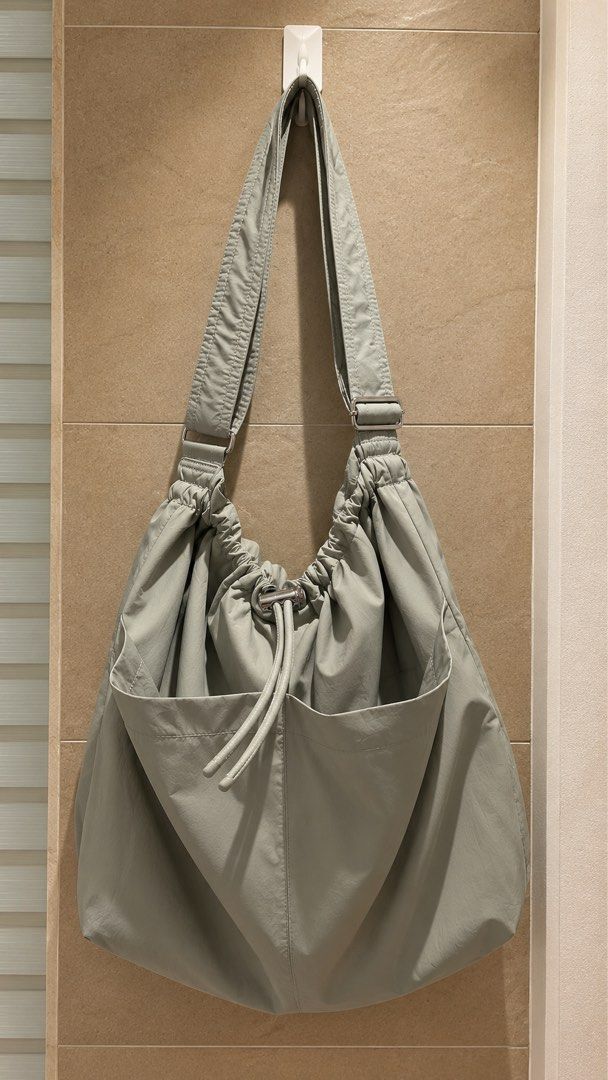 GU Sage Green Slouchy Shoulder Bag with Drawstring and Pockets (Category: Shoulder Bags) located in Manila. Submitted by wearmycloset.ph (Listing ID 1470832244, Image 1). Description: .