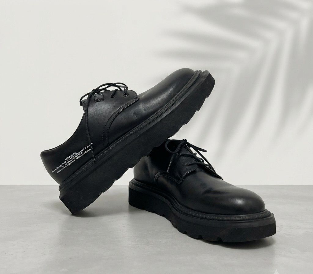 Undercover Chunky Sole Plain Toe Shoes (Category: Sneakers & Footwear) located in Baguio. Submitted by luxeloomarchive (Listing ID 1470743458, Image 2). Description: GU x Undercover Chunky Sole Plain Toe Shoes Own a piece of the limited-edition collaboration between Japanese streetwear icon Undercover and GU. These blend high-fashion punk aesthetics with everyday streetwear edge.✨ Features:Iconic Graphic: Features the printed "Kosmik Noise..." po