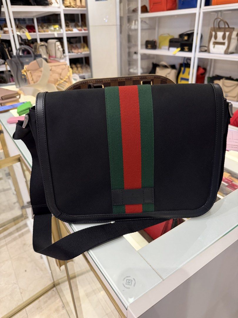 Gucci Black Canvas (Category: Sling Bags) located in Makati City. Submitted by lambogirl (Listing ID 1470875326, Image 2). Description: ✔️Gucci Black Canvas Techno Web Flap Messenger Bag (Model 630921). ✔️Like new condition ✔️free shipping or pick up (Makati) ✔️comes with strap, dust bag, entrupy, and bnew paper bag.