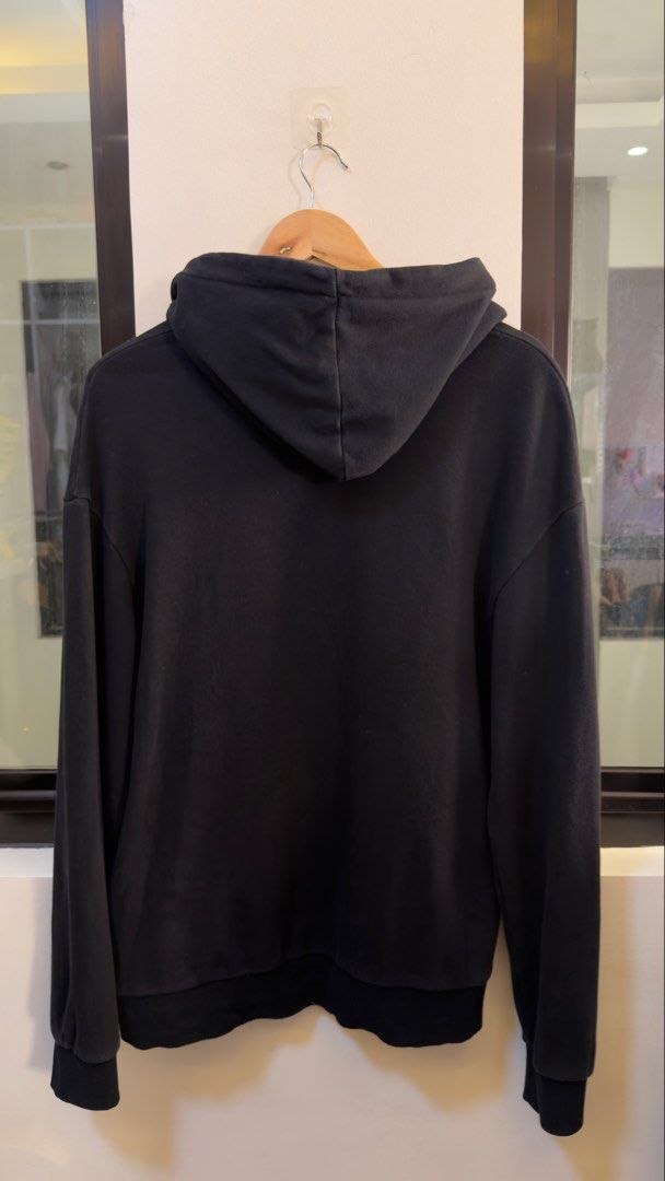 Gucci Black Hoodie (Category: Coats, Jackets and Outerwear) located in Paranaque City. Submitted by preluxeshop_ph (Listing ID 1470796944, Image 3). Description: Gucci Black Hoodie - Bold multicolored logo graphic on the chest - Size: L (tag attached) - Crafted in Italy - Features adjustable drawstring hood, ribbed cuffs, and hem - Excellent Condition.