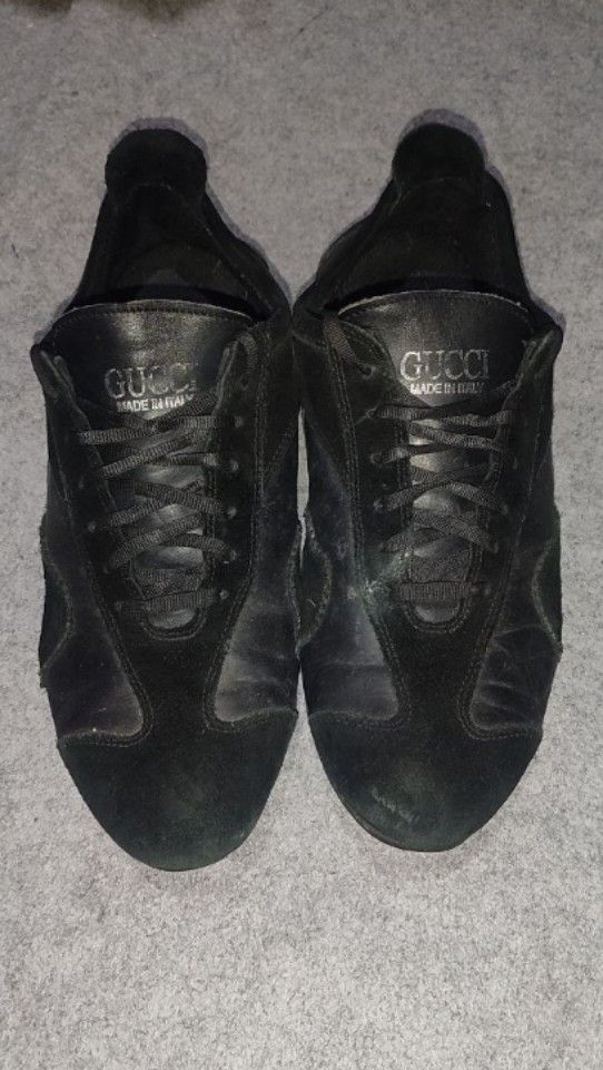Gucci Black Leather Sneakers (Category: Sneakers) located in Manila. Submitted by cosmictree_1321 (Listing ID 1470875157, Image 1). Description: - Brand: Gucci - Color: Classic All-Black - Material: Premium leather and suede panels - Details: Made in Italy stamped on the tongue, solid black soles, lace-up closure - Condition: Pre-loved with minor scuffs and wear marks on toes and uppers - Style: Great everyday casual shoes perfect for daily wear.
