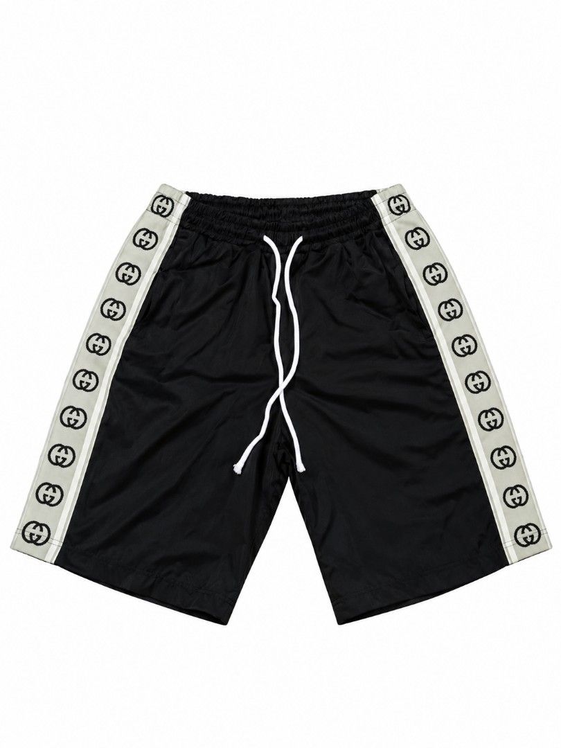 Gucci Black Logo Stripe Track Shorts (Category: Luxury Apparel) located in Magsaysay. Submitted by giansthrift (Listing ID 1470857152, Image 1). Description: - Color: Black with white drawstring and light grey side stripes - Details: Interlocking GG logo pattern on stripes, two side pockets - Fit: Relaxed fit, knee-length for all-day comfort - Material: Smooth, lightweight fabric - Style: Versatile piece, great for casual streetwear looks - Condi