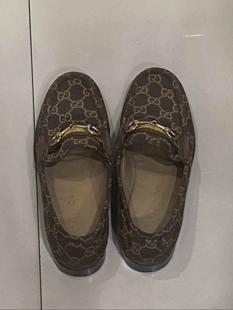 Gucci Brown Canvas Horsebit Loafers (Category: Loafers) located in Angeles City. Submitted by leluxe_atelier (Listing ID 1470813411, Image 3). Description: - Authentic Gucci horsebit loafers - Brown monogram canvas with signature web stripe - Elegant gold-tone hardware - Comfortable leather lining with visible Gucci branding - Versatile slip-on design for smart or casual wear.