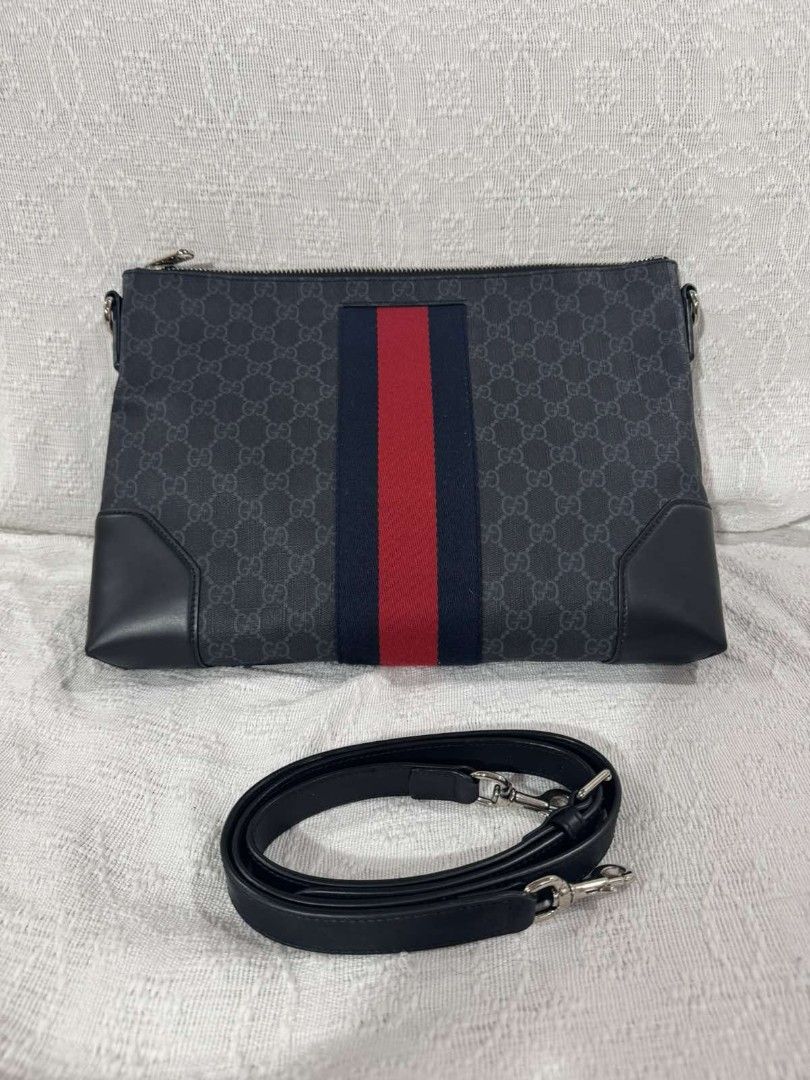 Gucci GG Crossbody Bag (Category: Luxury Bags & Wallets) located in Makati City. Submitted by emem.pre.owned.ph (Listing ID 1470786609, Image 1). Description: Gucci GG Supreme Web Crossbody Bag •Pouch in black and grey canvas •Depth :4cm •Width:34cm •Height:27cm •Strap: 60cm •coated canvas body with leather •trim and web detail •adjustable and detachable flat •leather strap •top zip closure •interior zip and slip pockets black Condition: EXCELLEN