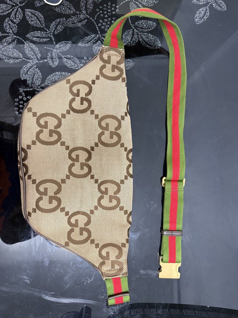 Gucci Jumbo GG Canvas Belt Bag (Category: Luxury Bags & Wallets) located in Cabuyao City. Submitted by lakasngthrift23 (Listing ID 1470848540, Image 3). Description: - Authentic Gucci belt bag featuring the iconic jumbo GG canvas pattern - Premium brown leather trim and classic gold-tone zipper hardware - Signature green and red webbing stripe detail near the base - Spacious main interior compartment for your daily essentials - Convenient front e