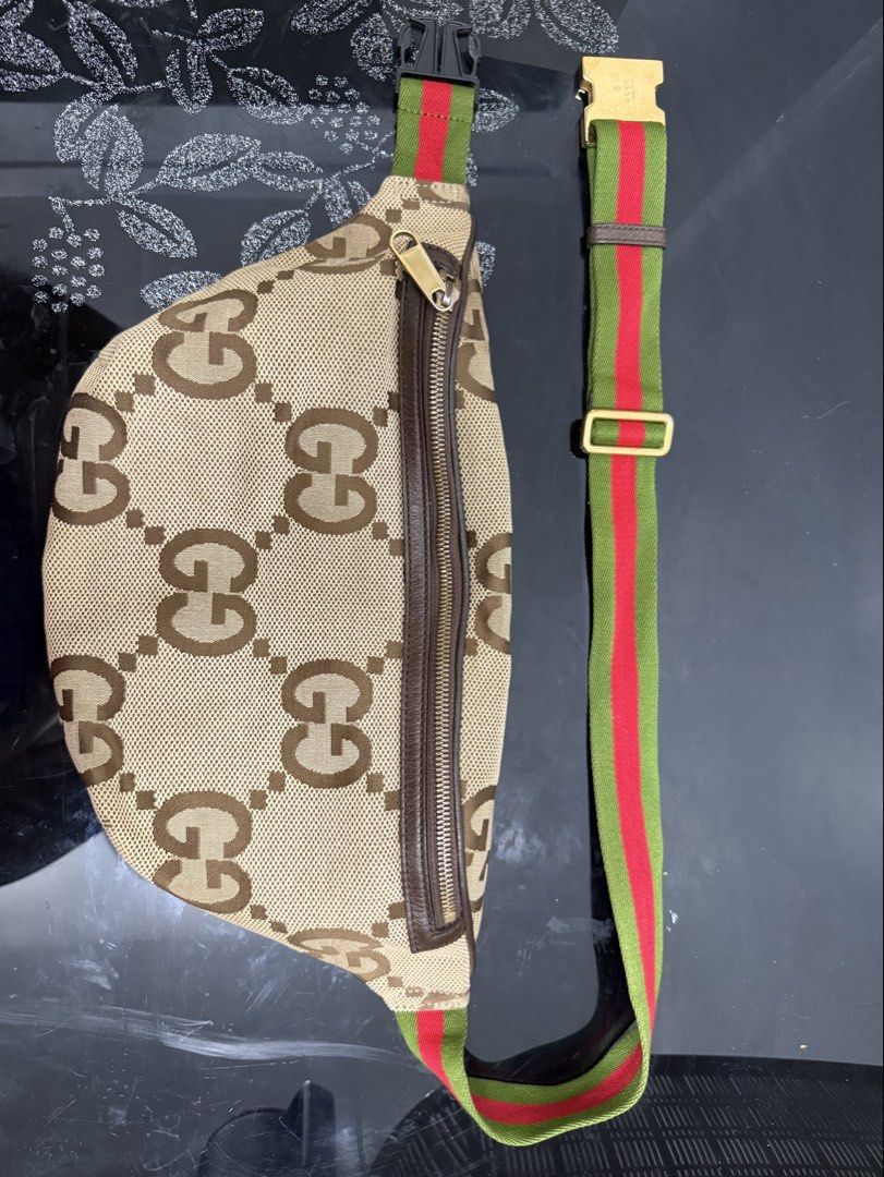 Gucci Jumbo GG Canvas Belt Bag (Category: Luxury Bags & Wallets) located in Cabuyao City. Submitted by lakasngthrift23 (Listing ID 1470848540, Image 1). Description: - Authentic Gucci belt bag featuring the iconic jumbo GG canvas pattern - Premium brown leather trim and classic gold-tone zipper hardware - Signature green and red webbing stripe detail near the base - Spacious main interior compartment for your daily essentials - Convenient front e