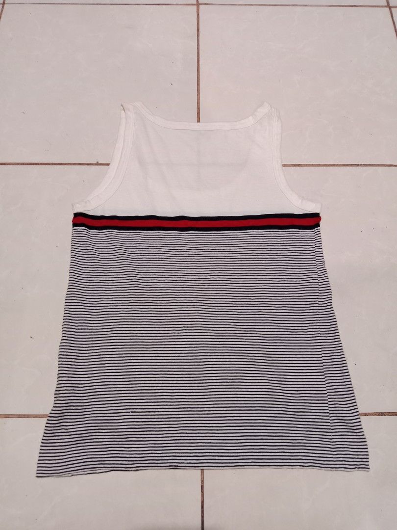 Gucci Striped Tank Top Size S (Category: Sleeveless) located in Bacolod City. Submitted by jorengrate26639 (Listing ID 1470843308, Image 2). Description: - Authentic Gucci white tank top - Iconic blue and red web stripe across the chest - Features signature Interlocking G metal hardware emblem - Scoop neck, sleeveless summer style - Size: S (tag attached at inner collar).