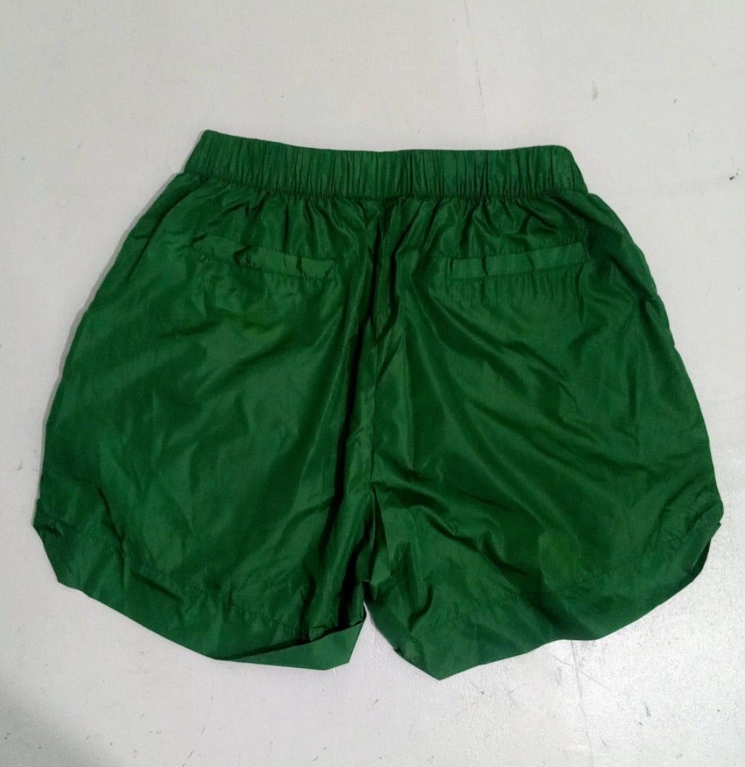 GUCCI Womens Nylon Shorts (Category: Luxury Apparel) located in Manila. Submitted by eriiicaspage (Listing ID 1470840120, Image 2). Description: PreOwned LikeNew Lightly Used Gucci Green Nylon Shorts - Item: Green Nylon Shorts - Size: 38 Medium (M) - Material: Lightweight nylon - Features: Elastic waistband, convenient side pockets, and back welt pockets - Design: Distinctive floral and green striped taping down the sides - Origin: Made in Italy 