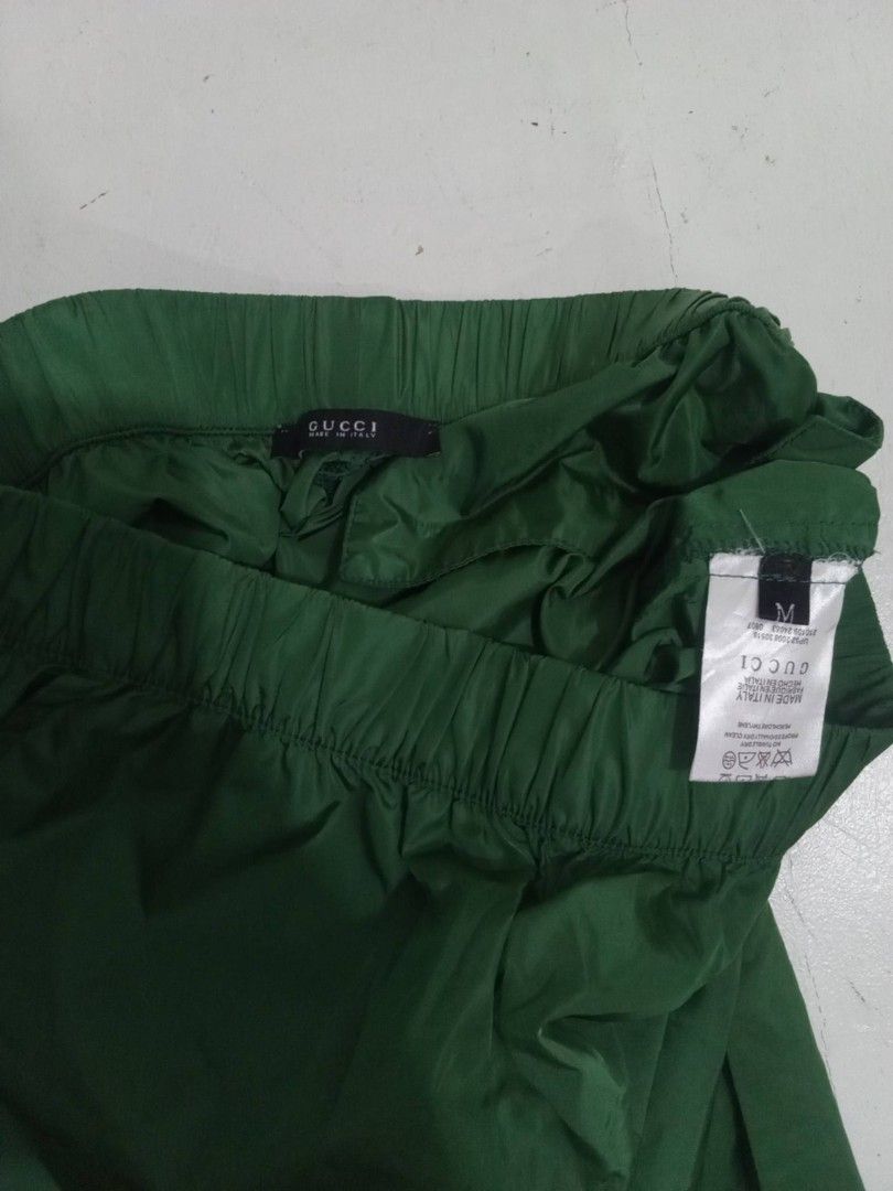 GUCCI Womens Nylon Shorts (Category: Luxury Apparel) located in Manila. Submitted by eriiicaspage (Listing ID 1470840120, Image 3). Description: PreOwned LikeNew Lightly Used Gucci Green Nylon Shorts - Item: Green Nylon Shorts - Size: 38 Medium (M) - Material: Lightweight nylon - Features: Elastic waistband, convenient side pockets, and back welt pockets - Design: Distinctive floral and green striped taping down the sides - Origin: Made in Italy 
