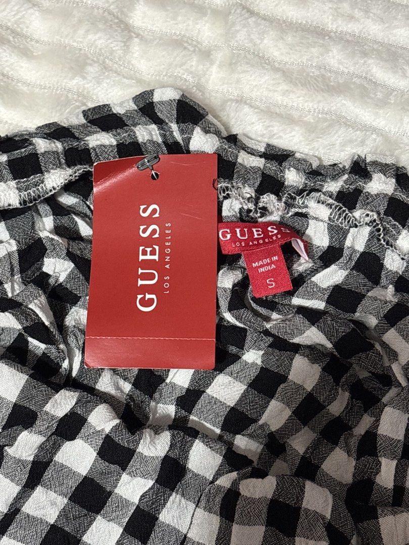 GUESS Lory Off Shoulder Romper Black Gingham Size S (Category: Rompers) located in Quezon City. Submitted by xoxoari (Listing ID 1470824820, Image 2). Description: - Brand: GUESS (Lory Off-Shoulder Romper) - Color/Pattern: Jet Black Multi Gingham Print - Size: Small (fits true to size) - Condition: Brand new with original tags attached - Retail Price: $54.99 - Features: Short puff sleeves, flattering smocked waist, and cute tie detail at the neck