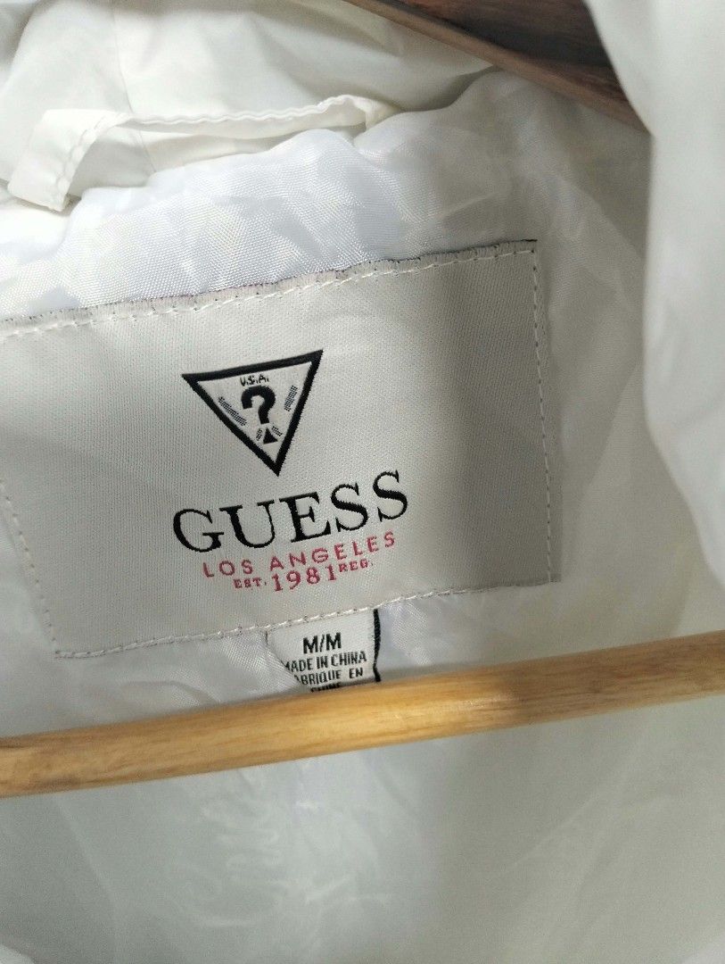 Guess White Quilted Hooded Puffer Jacket Size M (Category: Babies & Kids Fashion) located in Bulacan. Submitted by theroadthrift (Listing ID 1470931125, Image 2). Description: - Brand: Guess - Size: Med (KIDS) - Color: Classic White - Material: Nylon shell with quilted diamond pattern - Features: Hooded, front zipper with snap button closure, two front pockets - Condition: Great staple piece for cooler weather.