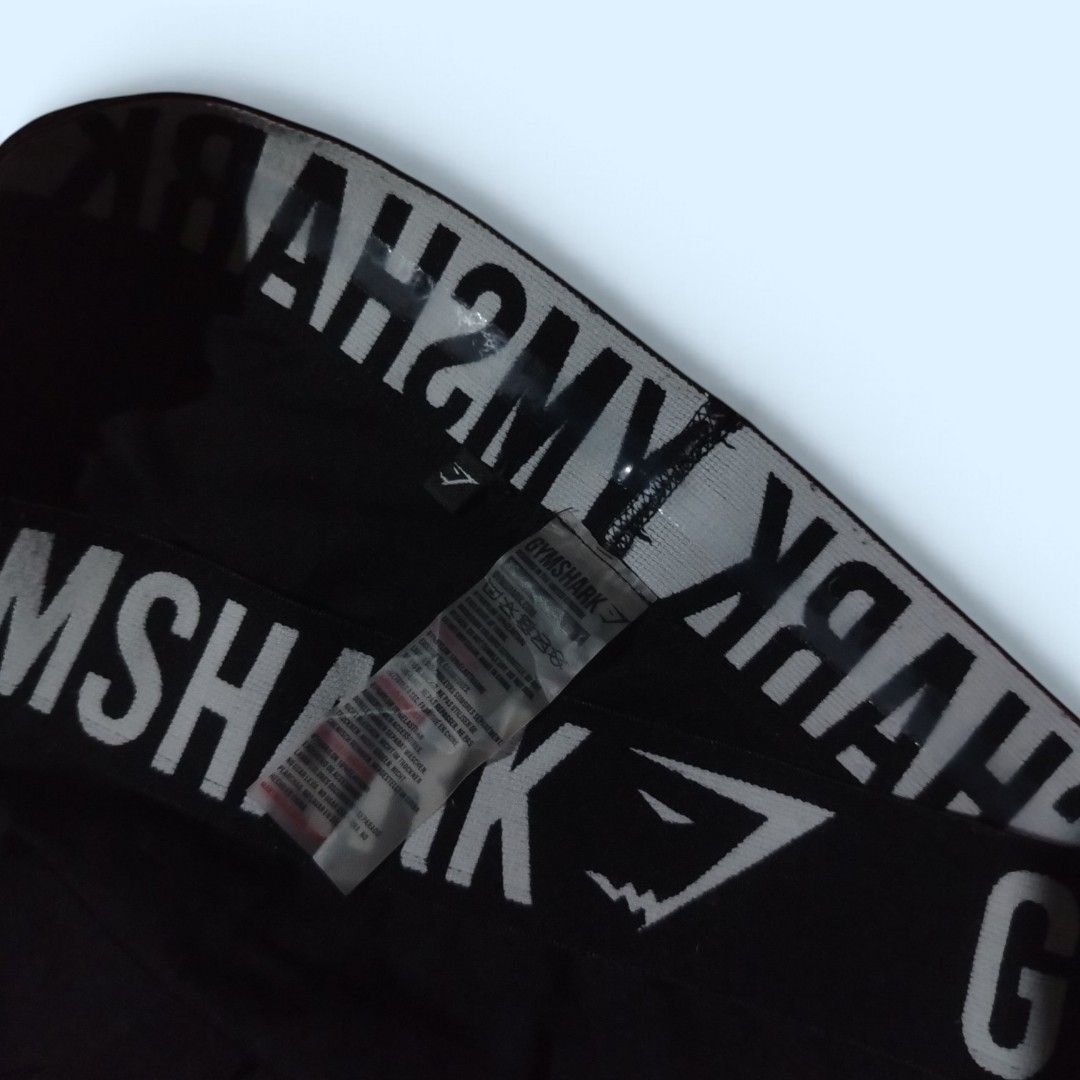 Gymshark Black Leggings (Category: Activewear) located in Tayabas. Submitted by jthriftshop. (Listing ID 1470858931, Image 2). Description: - Brand: Gymshark - Color: Classic black, easy to match with any sports top or hoodie - Length: Full length tights - Waistband: Elastic waistband featuring the Gymshark logo all around - Fabric: Stretchable, holds shape well, and comfortable for workouts or casual wear - Condition: Inside care tag attached at