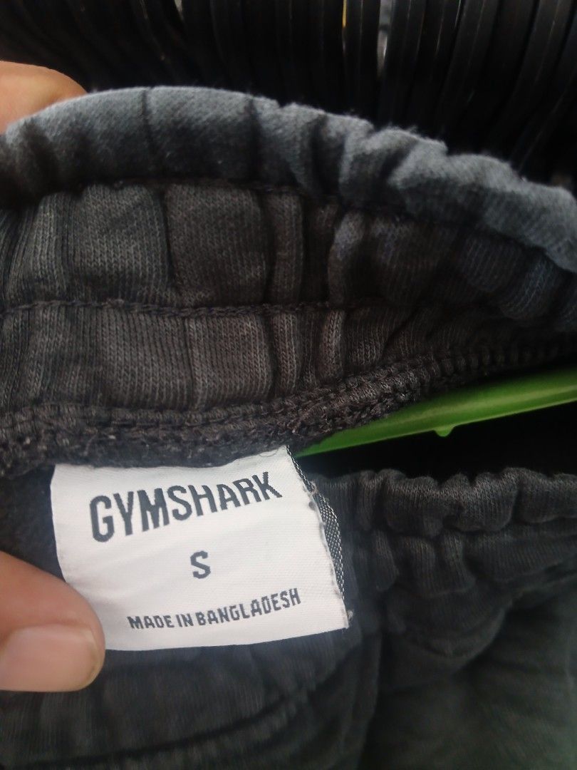 Gymshark Black Shorts Size S (Category: Shorts) located in San Jose. Submitted by garments17 (Listing ID 1470865757, Image 2). Description: - Brand: Gymshark - Color: Black - Size: Small (Tag attached) - Material: Soft cotton blend - Fit: Adjustable drawstring waist - Details: Small Gymshark logo on bottom left leg - Origin: Made in Bangladesh - Condition: Brand new with tags, ideal for workouts or lounging.