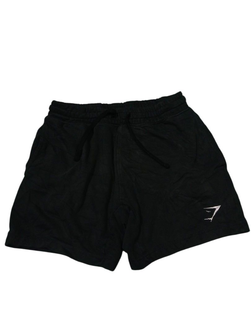 Gymshark Black Shorts Size S (Category: Shorts) located in San Jose. Submitted by garments17 (Listing ID 1470865757, Image 1). Description: - Brand: Gymshark - Color: Black - Size: Small (Tag attached) - Material: Soft cotton blend - Fit: Adjustable drawstring waist - Details: Small Gymshark logo on bottom left leg - Origin: Made in Bangladesh - Condition: Brand new with tags, ideal for workouts or lounging.