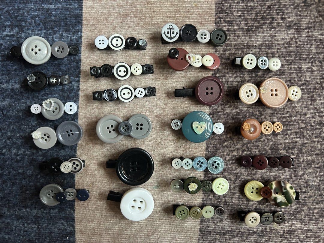 Handmade Button Hair Clips Variety Pack (Category: Hair Accessories) located in Manila. Submitted by ardol (Listing ID 1470767702, Image 2). Description: 10 each - Huge bundle of handmade hair clips made from assorted buttons - Available in green, purple, blue, pink, black, white, and neutral tones - Features various sizes and unique button combinations on secure alligator clips - Some pieces decorated with cute little star or heart charms - Adds