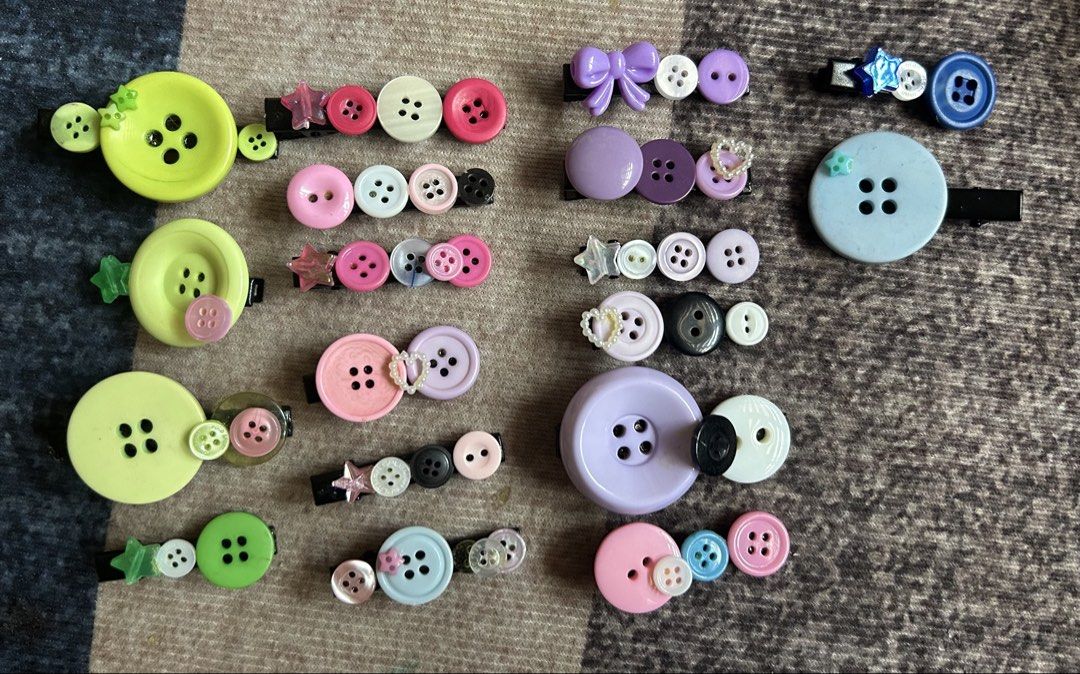 Handmade Button Hair Clips Variety Pack (Category: Hair Accessories) located in Manila. Submitted by ardol (Listing ID 1470767702, Image 1). Description: 10 each - Huge bundle of handmade hair clips made from assorted buttons - Available in green, purple, blue, pink, black, white, and neutral tones - Features various sizes and unique button combinations on secure alligator clips - Some pieces decorated with cute little star or heart charms - Adds