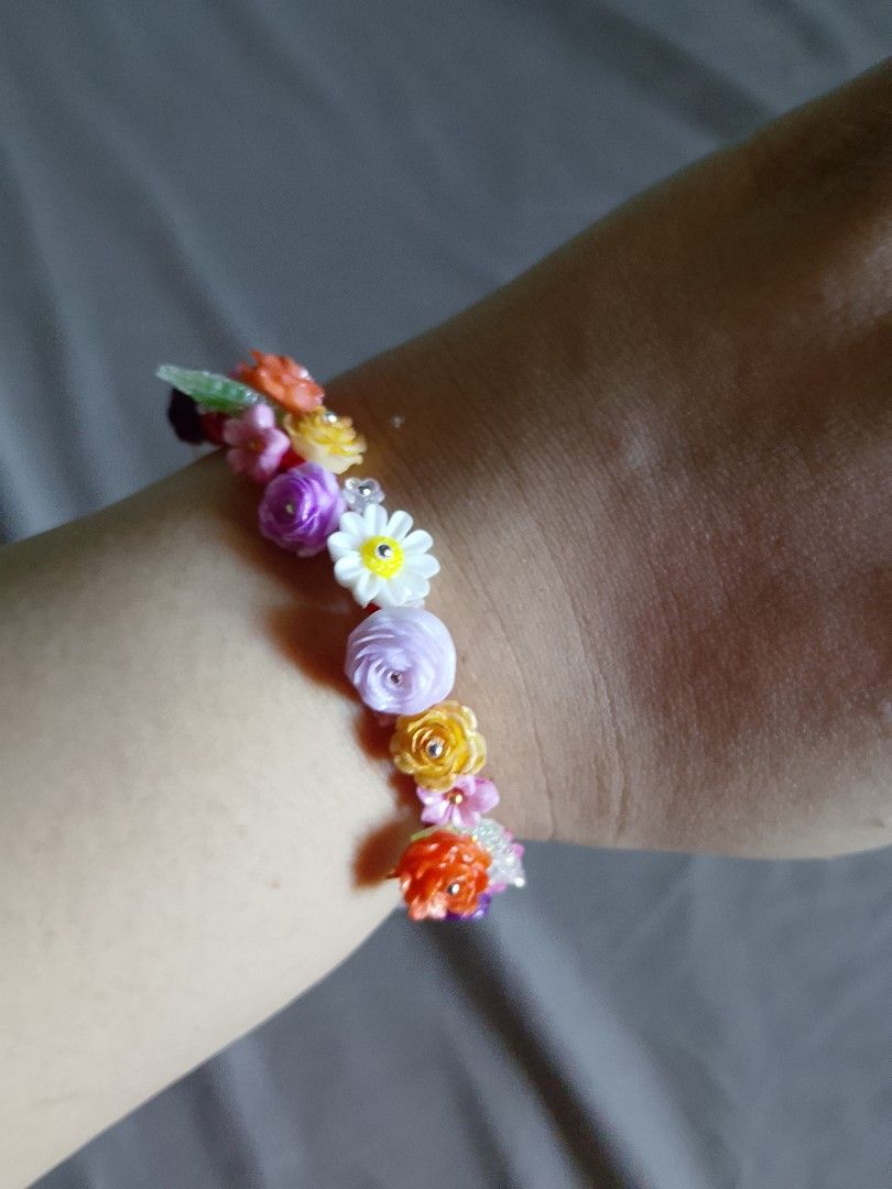 Handmade Floral Beaded Charm Bracelet Assorted Colors (Category: Bracelets) located in Abucay. Submitted by idontlikemondays (Listing ID 1470847775, Image 1). Description: Handmade resin charm bracelets featuring miniature flowers and butterflies on woven cords. Available in pastels, pinks, blues, and purples. Message us to check specific color availability!.