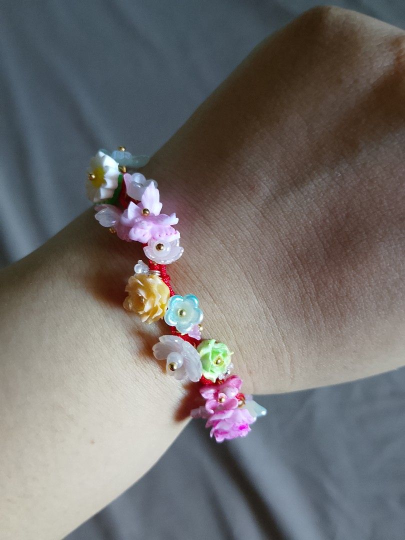 Handmade Floral Beaded Charm Bracelet Assorted Colors (Category: Bracelets) located in Abucay. Submitted by idontlikemondays (Listing ID 1470847775, Image 3). Description: Handmade resin charm bracelets featuring miniature flowers and butterflies on woven cords. Available in pastels, pinks, blues, and purples. Message us to check specific color availability!.