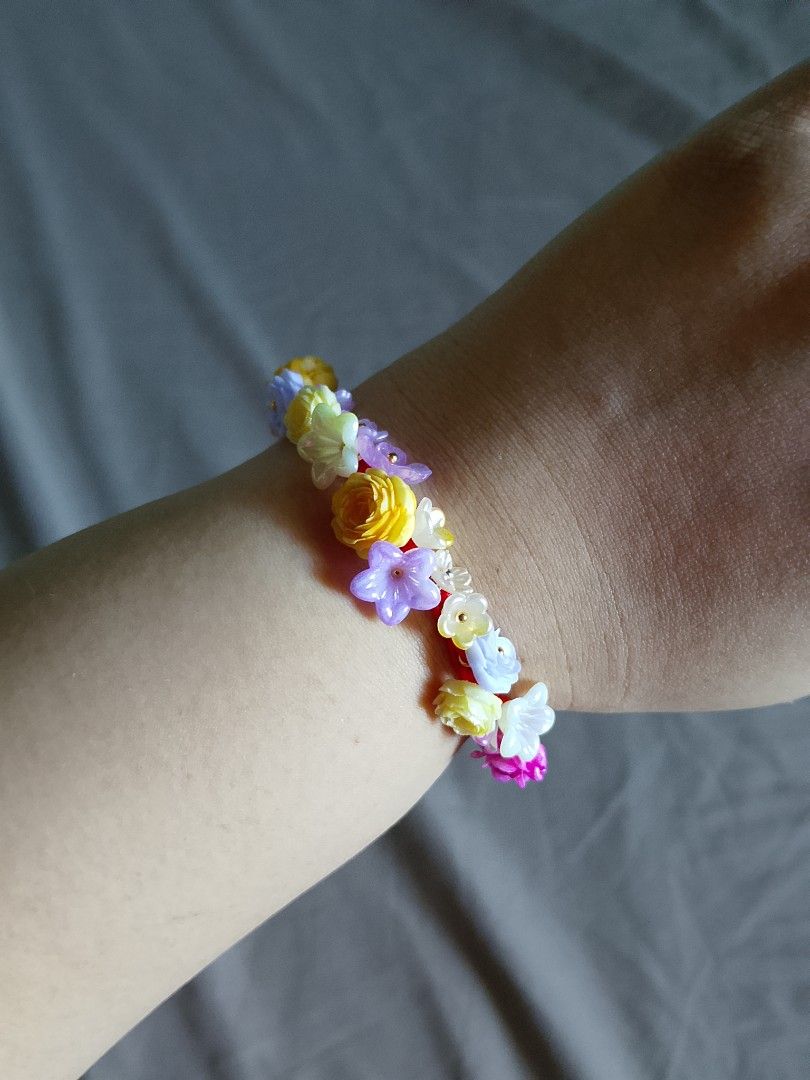 Handmade Floral Beaded Charm Bracelet Assorted Colors (Category: Bracelets) located in Abucay. Submitted by idontlikemondays (Listing ID 1470847775, Image 2). Description: Handmade resin charm bracelets featuring miniature flowers and butterflies on woven cords. Available in pastels, pinks, blues, and purples. Message us to check specific color availability!.