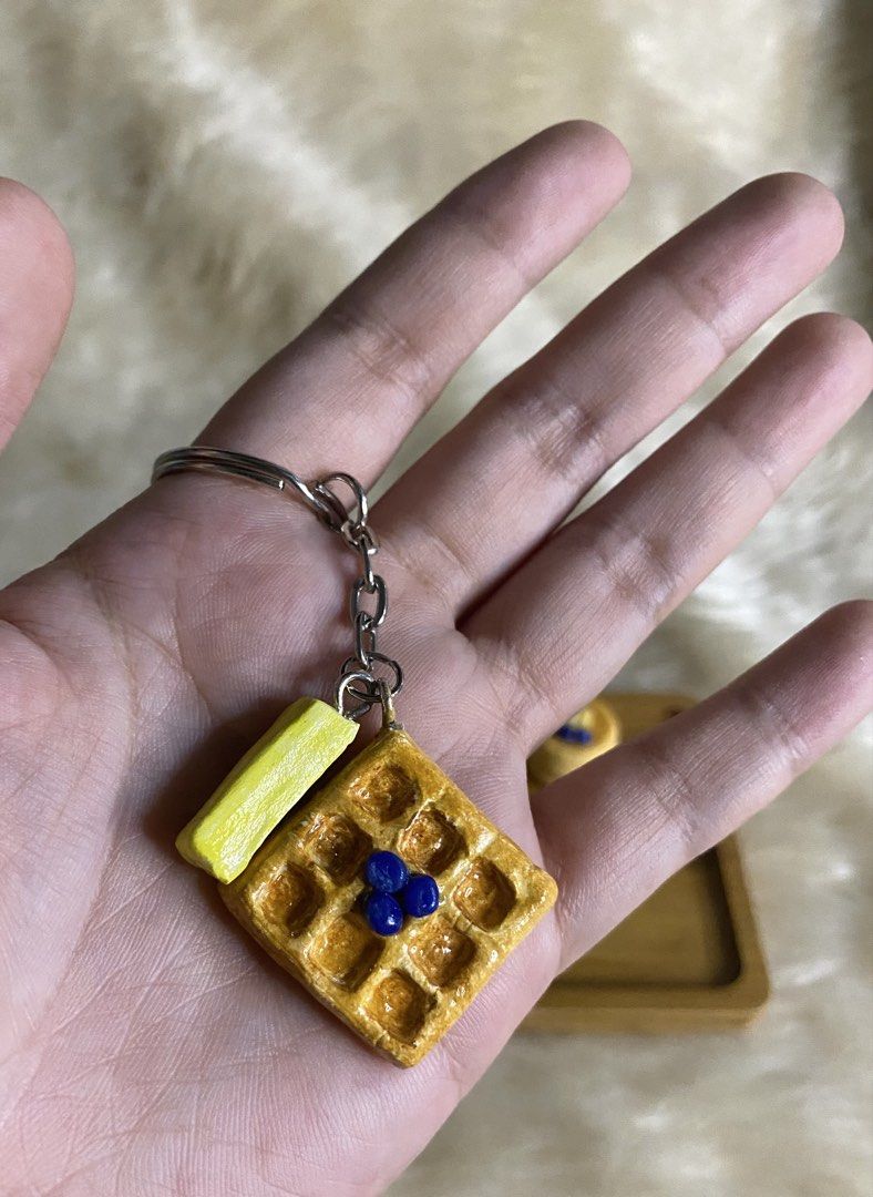 Handmade Miniature Bread and Pastry Keychains (Category: Handmade Craft) located in Manila. Submitted by littleatorie.studio (Listing ID 1470767779, Image 3). Description: - Handmade miniature bakery keychains crafted from durable polymer clay - Available in multiple adorable designs: waffles, croissants, baguettes, and cinnamon rolls - Features realistic, glossy details including butter pats and fruit toppings - Equipped with a sturdy metal spli