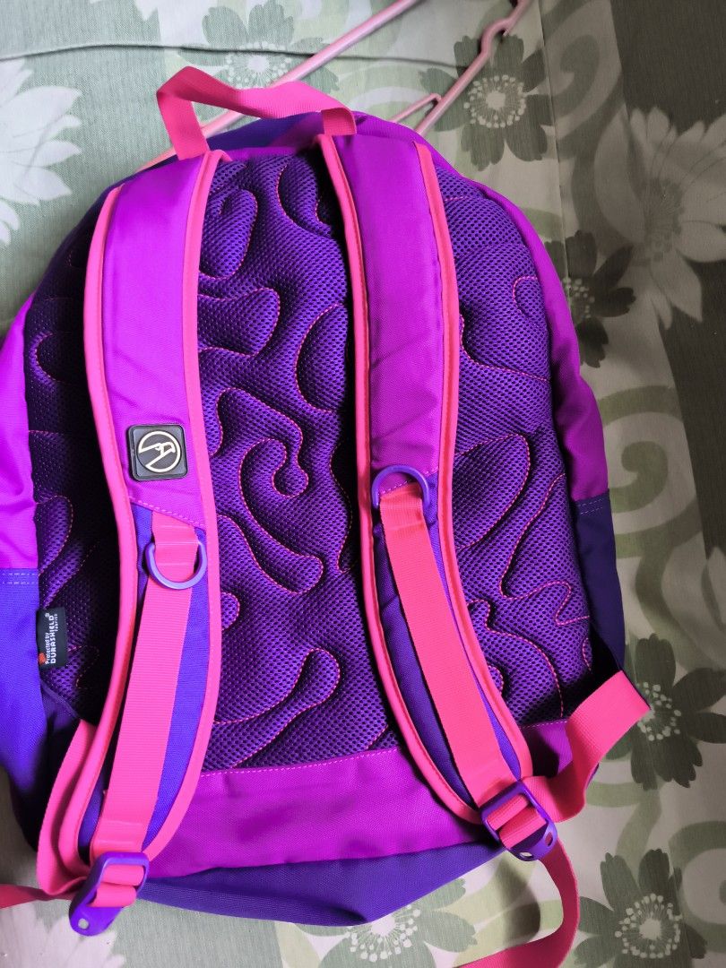 Hawk Purple and Pink School Backpack Bag (Category: Backpacks) located in Bulacan. Submitted by jvblaguard08460 (Listing ID 1470756754, Image 2). Description: - Brand: Hawk - Colorway: Purple and pink - Compartments: Multiple zipped front pockets and a spacious main interior - Interior: Durable patterned lining - Straps: Comfortable, padded pink shoulder straps with sturdy zippers and pull tabs - Condition: Clean inside and out - Ideal Use: Perfe