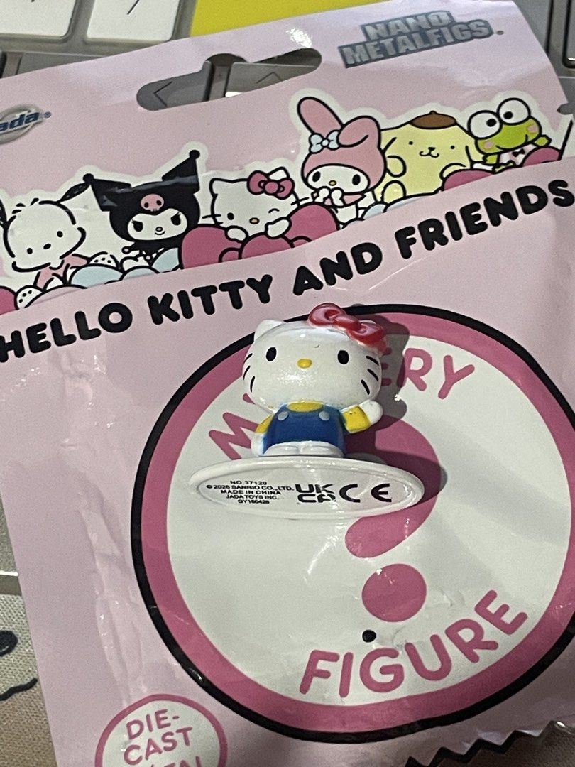Hello Kitty Nano Metalfigs (Category: Designer & Blind Box Toys) located in Pasig City. Submitted by babystarcandykoo (Listing ID 1470918894, Image 1). Description: - Authentic Sanrio x Jada Toys Nano Metalfigs mystery figure - Character: Kitty in blue overalls with her iconic red hair bow - Condition: Brand new, taken straight from the blind bag just to check the character - Includes white base with official stamped copyright text on the bottom 