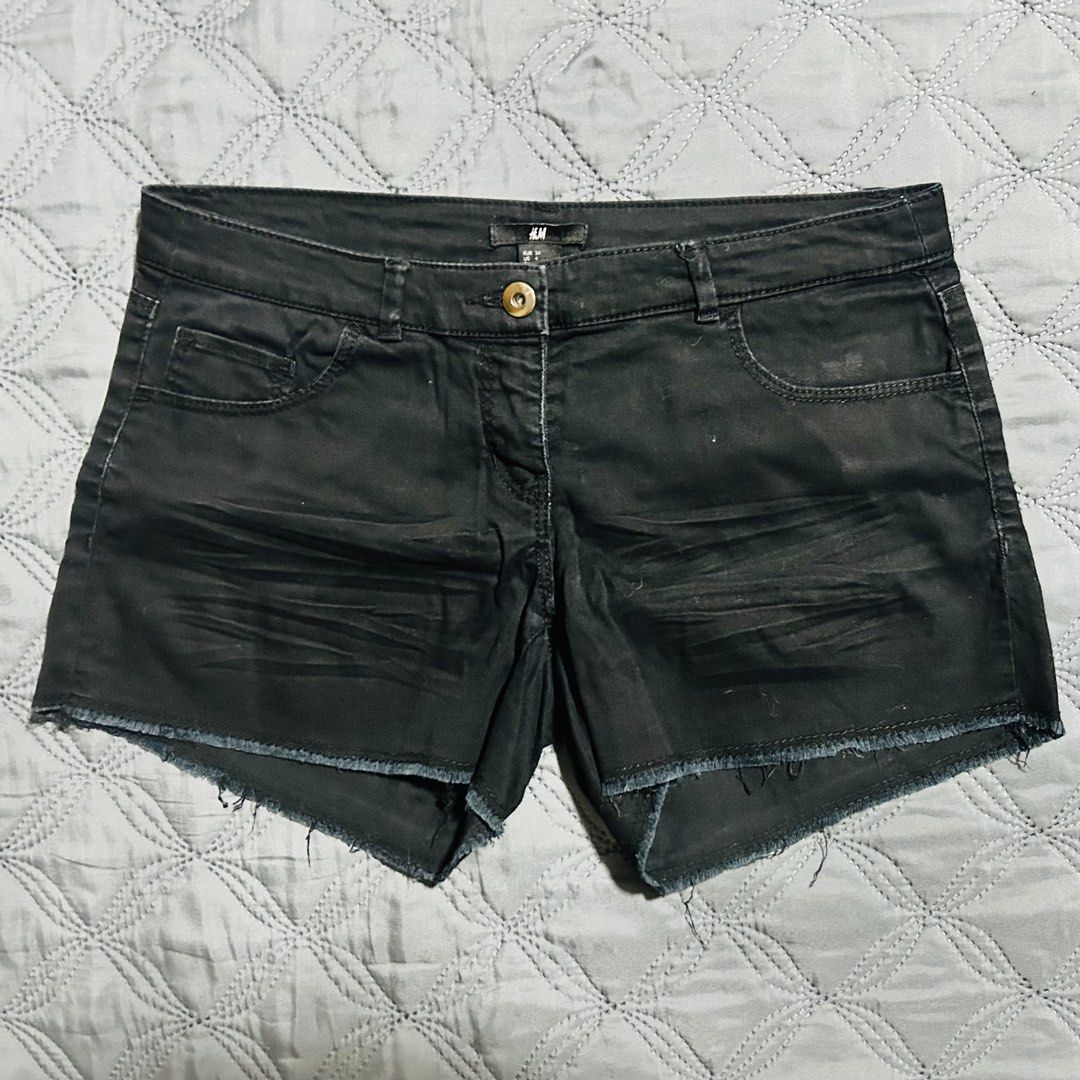 H&M Black Denim Shorts Size US 4 (Category: Shorts) located in Quezon City. Submitted by halfofit (Listing ID 1470747075, Image 1). Description: - Brand: H&M - Size: US 4 / EUR 34 - Color: Black - Material: 98% Cotton, 2% Elastane - Features: Raw hem with frayed edges, button closure, and front pockets - Condition: Great warm-weather staple.