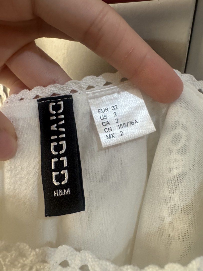 H&M Divided White Lace Flowy Dress (Category: Dresses) located in Valenzuela. Submitted by declutter203 (Listing ID 1470818507, Image 2). Description: - Like New - Size XS (Fit up to small) MOP: Gcash/Maribank MOD: J&T or Grab/lalamove Tags: Zara, H&M, Love Bonito, Mango, Bershka, Uniqlo, GU, Topshop, Araw the Line, SM woman, reformation dress, suzy clothing .