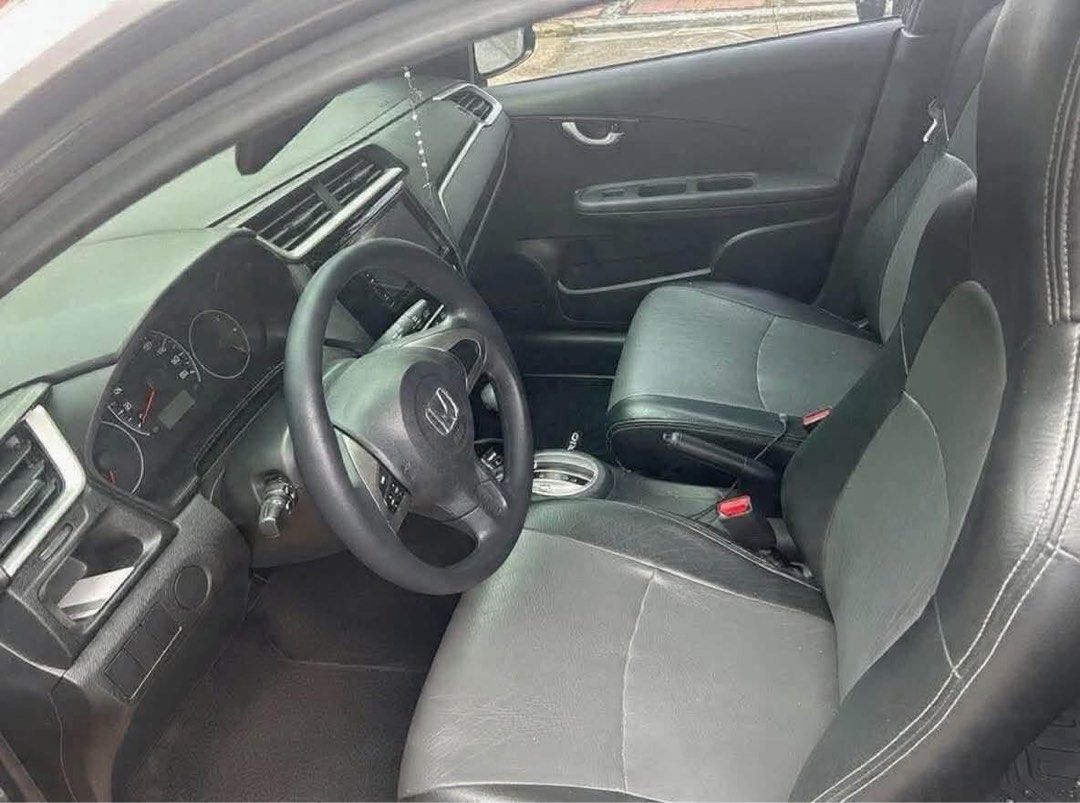 Honda Brio (Category: Used Cars) located in Quezon City. Submitted by ruhermano (Listing ID 1470779593, Image 2). Description: 2021 Honda Brio 1.2 V CVT car Key Specifications: * 📍 Location: Q.C * 🎨 Color: Exterior Color : Modern Steel / Interior Color: Gray-Black * Leather Seat Covers by Lederland * Intact Interior * Touchscreen Infotainment * Dual SRS Airbag * ⛽ Fuel Type: Gas * 📄 Complete papers * Registered until February 2027 * Insurance 