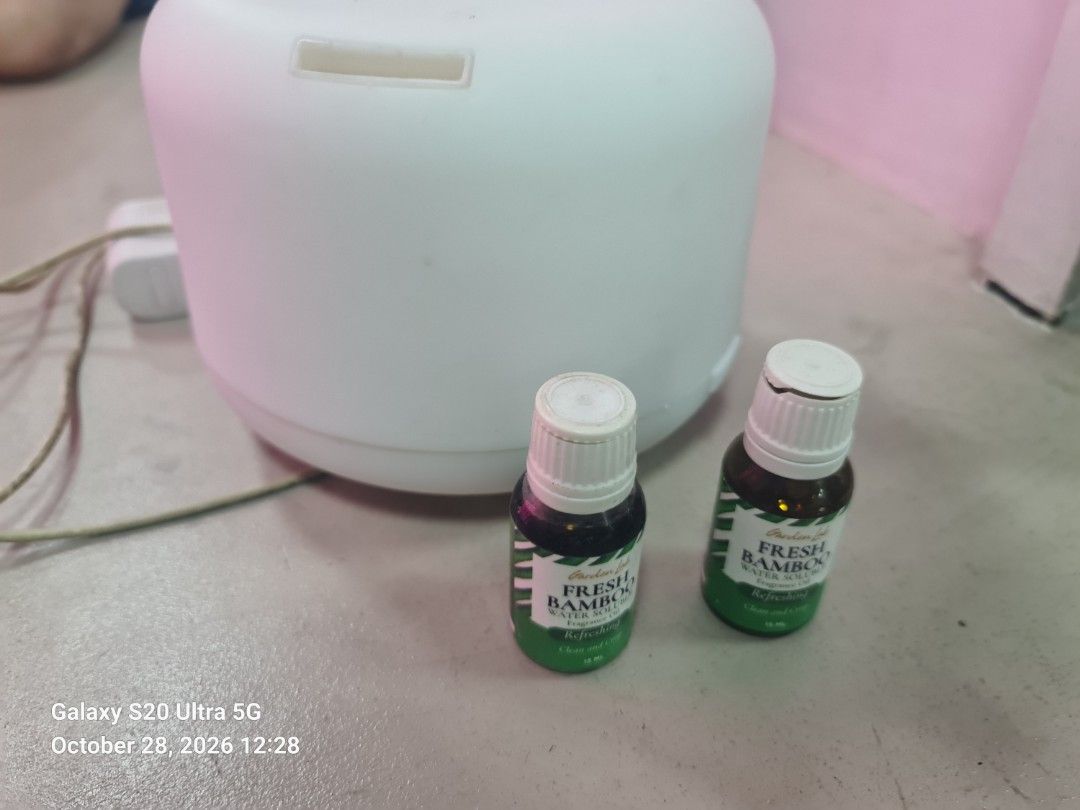 Humidifier White Aromatherapy Diffuser with Fresh Bamboo Oils (Category: Home Fragrance) located in Manila. Submitted by kingmcvie (Listing ID 1470777360, Image 2). Description: - Item: White ultrasonic aroma diffuser - Condition: Used only a few times, works perfectly - Inclusions: Power adapter and 2 bottles of Garden Lab Fresh Bamboo oil-soluble fragrance oil - Reason for selling: Decluttering room items - Perfect for relaxing home aromatherap