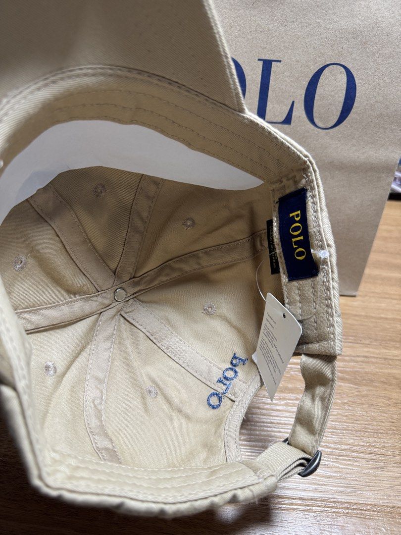 INDONESIA BRAND POLO CAP (Category: Caps & Hats) located in Manila. Submitted by leiiplayys (Listing ID 1470843272, Image 3). Description: - Color: Versatile neutral beige - Design: Navy blue polo player embroidery on front with matching back strap lettering - Fit: Adjustable metal buckle closure with engraved polo branding - Condition: Brand new with interior brand tags and original store tag attached - Style: Perfect for everyday casual outfits