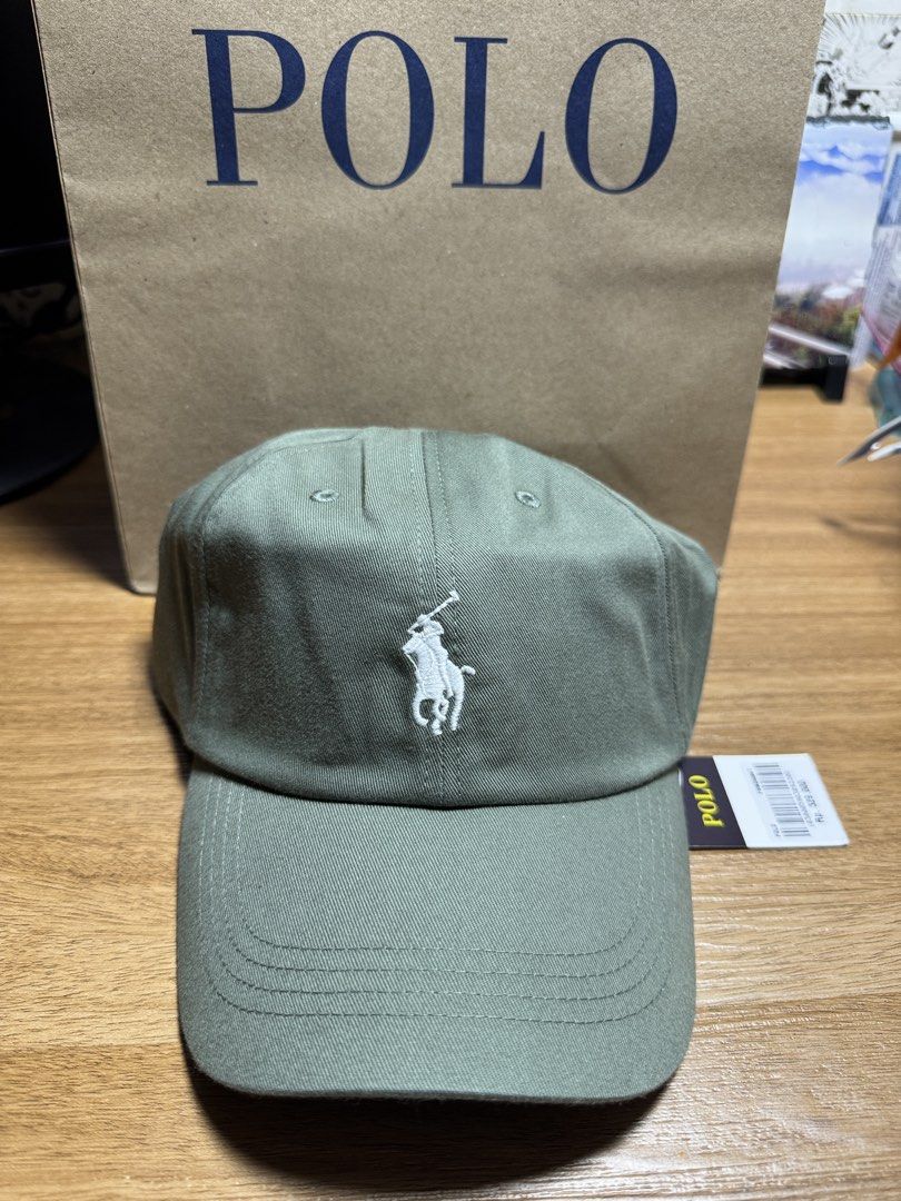 INDONESIA BRAND POLO CAP (Category: Caps & Hats) located in Manila. Submitted by leiiplayys (Listing ID 1470843412, Image 1). Description: - Brand: Polo Ralph Lauren - Color: Olive green with white embroidery - Details: White embroidered pony logo on front, white POLO lettering on back - Hardware: Adjustable strap with POLO-engraved metal buckle - Interior: Navy blue tag with yellow POLO text - Condition: Brand new, unworn, clean fabric with orig