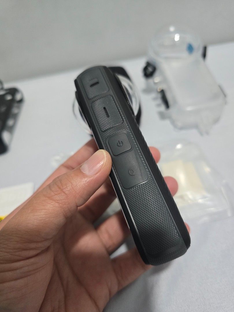 Insta360 X4 Action Camera with Case and Accessories (Category: Video Cameras) located in Las Pinas. Submitted by hantrez (Listing ID 1470898371, Image 3). Description: Insta360 X4 Camera Bundle - Ready to Use! - Condition: Tested working, clean lenses, and scratch-free body. - Main Unit & Battery: Insta360 X4 camera with battery in case. - Protection: Protective dive case, black zip pouch, and lens guards included. - Mounts & Accessories: Frame m