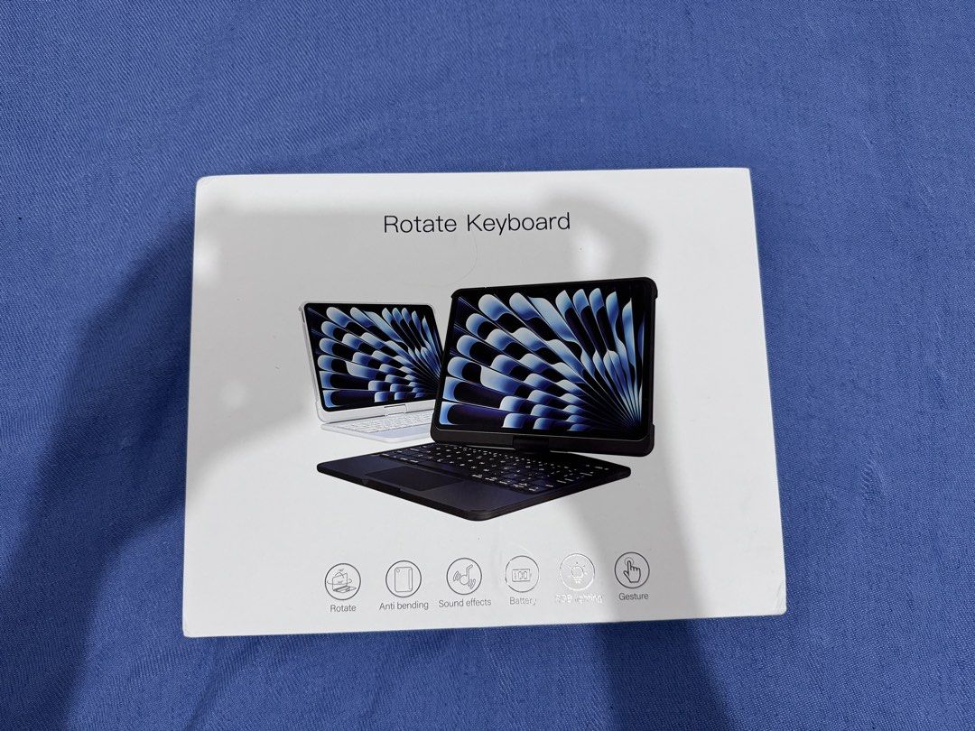 IPAD CASE ROTATING KEYBOARD WITH RGB LIGHTING (Category: Cases & Sleeves) located in Manila. Submitted by kazoo1490 (Listing ID 1470782143, Image 2). Description: TRANSFORM YOUR iPAD INTO A MACBOOK-STYLE SETUP! Compatible with iPad Air 7 (11-inch) / iPad Air 8 (11-inch) Condition: Good as brand new Reason for Selling: No longer using it. Features & Specifications Backlit Keyboard * 7-color backlighting options * Easy to type in dark or dim enviro