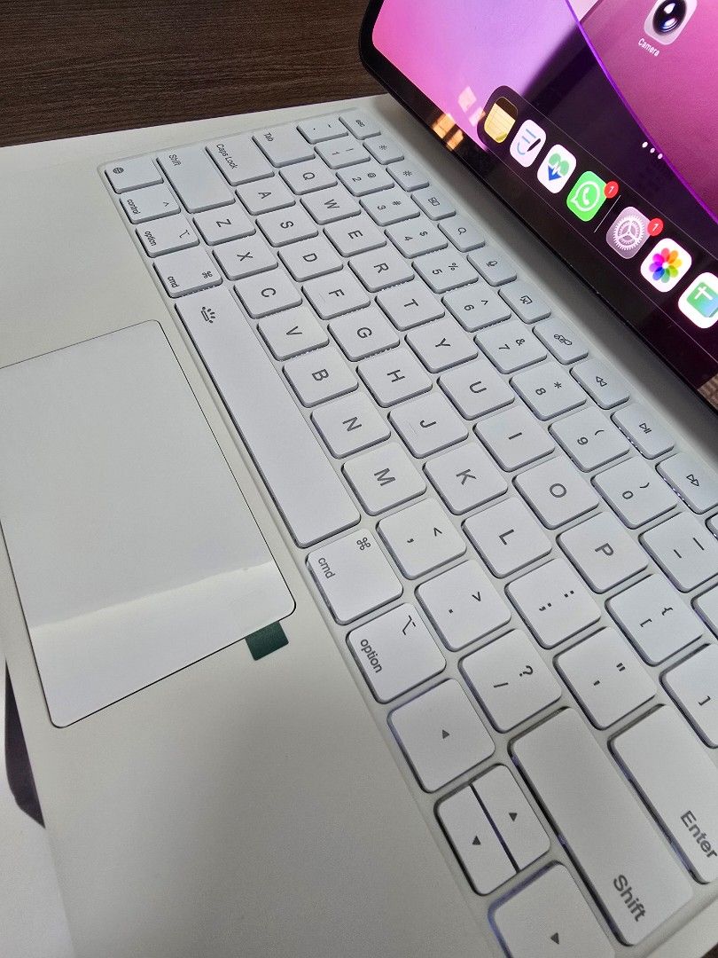 Ipad Pro 13 Magic Keyboard (White) (Category: Computer Keyboard) located in Quezon City. Submitted by olxph_917070756 (Listing ID 1470766179, Image 2). Description: No issues. Opened but never used. - Magic Keyboard case in clean white for iPad Pro - Features a built-in trackpad, backlit keys, and full QWERTY layout - Magnetic floating cantilever design for easy adjustment - USB-C pass-through charging port - Includes original box and manual.
