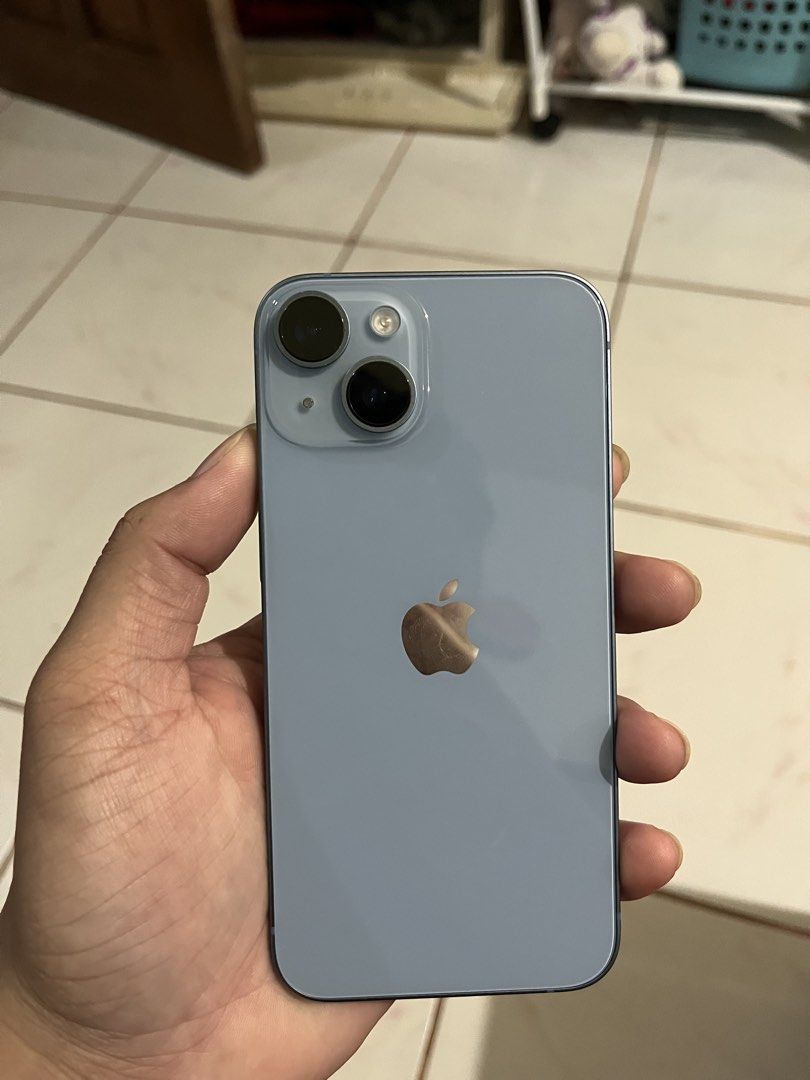 Iphone 14 (Category: iPhone 14 Series) located in Puerto Princesa. Submitted by yla_sells (Listing ID 1470883056, Image 2). Description: - Model: Apple iPhone 14 - Storage Capacity: 128 GB - Color: Blue - Condition: 8/10 (Pre-loved, well-maintained) - Battery Health: 88% - Warranty: Limited warranty active until May 1, 2027 This May 2026 lang binili. -Unit and Case Only.