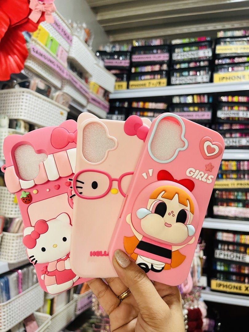 Iphone 16 Case (Category: Cases & Sleeves) located in Mandaluyong City. Submitted by co.case (Listing ID 1470810505, Image 1). Description: Hello Kitty Eyeglass- ₱220 Hello Kitty with Strawberry- ₱250 Blossom- ₱250.