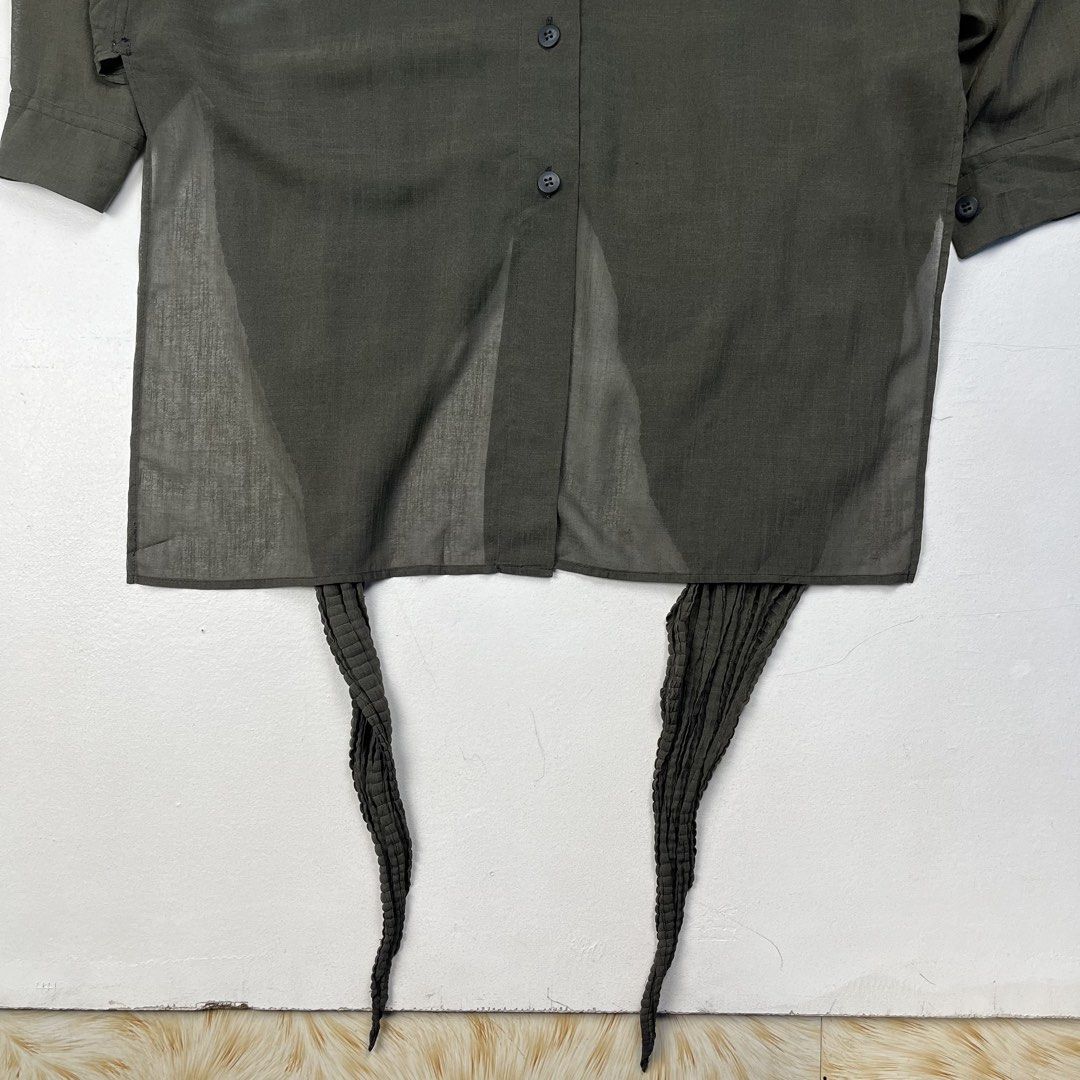 Issey Miyake 1990s Back Pleated Tail Sheer Button Down Ls Shirt (Category: Luxury Apparel) located in Quezon City. Submitted by forgarments (Listing ID 1470828987, Image 3). Description: Issey Miyake 1990s Back Pleated Tail Sheer Button Down Ls Shirt Excellent Condition Size: XS Shoulder: 20.5 Inches Chest width: 24 Inches Sleeve: 20 Inches Length: front 32.5 (back tail 47.5) Inches - 60% Triacetate 40% Polyester - Pleated back tail - Button down