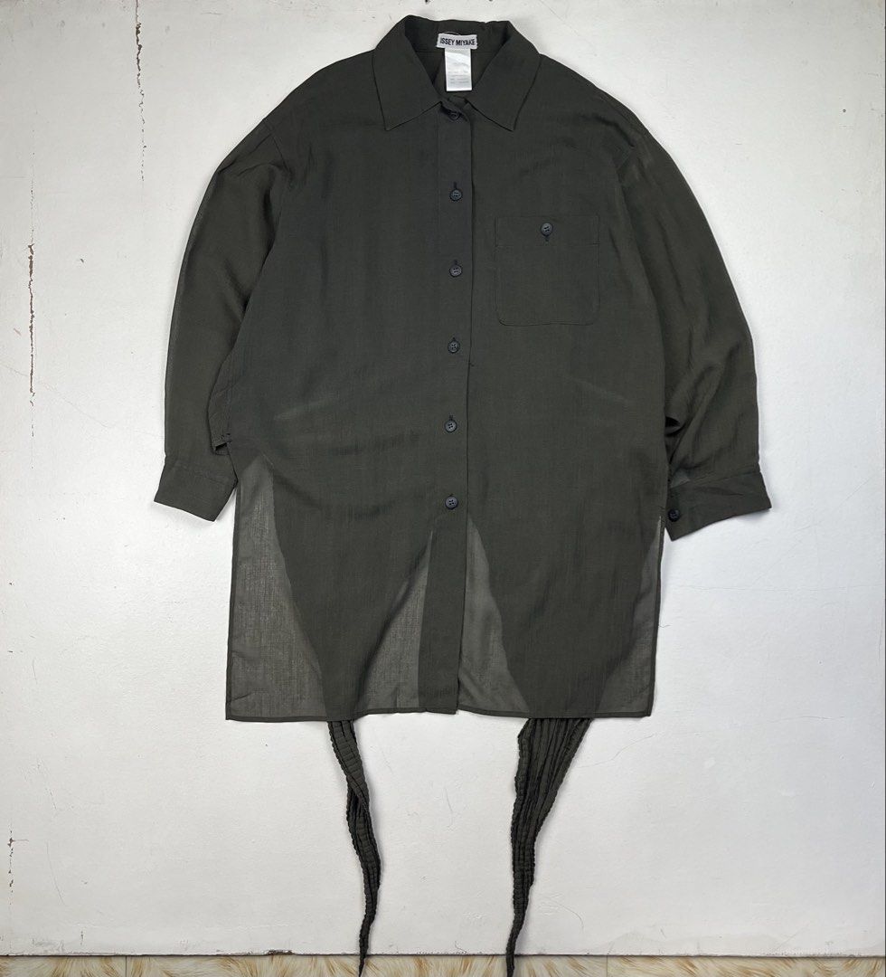 Issey Miyake 1990s Back Pleated Tail Sheer Button Down Ls Shirt (Category: Luxury Apparel) located in Quezon City. Submitted by forgarments (Listing ID 1470828987, Image 1). Description: Issey Miyake 1990s Back Pleated Tail Sheer Button Down Ls Shirt Excellent Condition Size: XS Shoulder: 20.5 Inches Chest width: 24 Inches Sleeve: 20 Inches Length: front 32.5 (back tail 47.5) Inches - 60% Triacetate 40% Polyester - Pleated back tail - Button down
