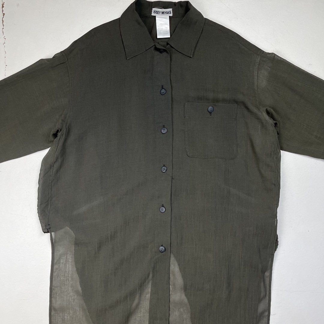 Issey Miyake 1990s Back Pleated Tail Sheer Button Down Ls Shirt (Category: Luxury Apparel) located in Quezon City. Submitted by forgarments (Listing ID 1470828987, Image 2). Description: Issey Miyake 1990s Back Pleated Tail Sheer Button Down Ls Shirt Excellent Condition Size: XS Shoulder: 20.5 Inches Chest width: 24 Inches Sleeve: 20 Inches Length: front 32.5 (back tail 47.5) Inches - 60% Triacetate 40% Polyester - Pleated back tail - Button down