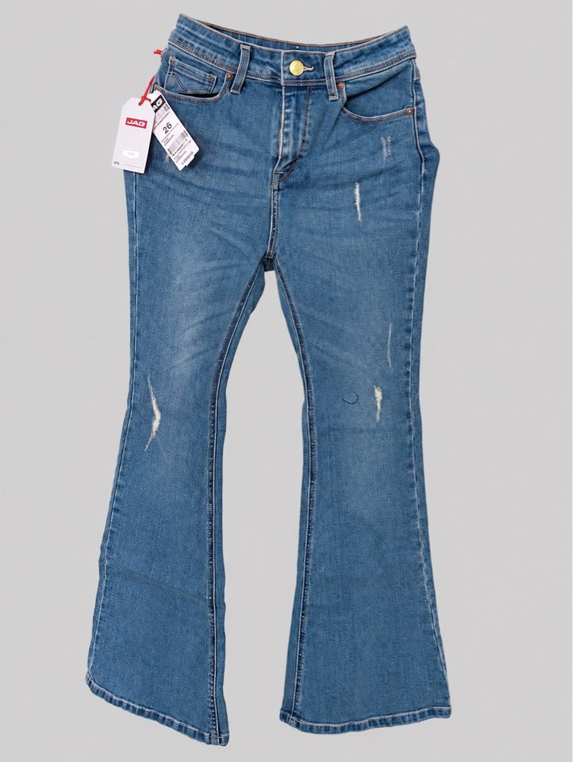 JAG Flare Denim Jeans Size 26 (Category: Jeans) located in Bacoor. Submitted by goodfinds02 (Listing ID 1470862542, Image 1). Description: - Brand: JAG - Style: High-waist flare jeans - Color/Wash: Medium wash blue denim - Details: Light distressing on thighs and knees, front zipper and button closure - Pockets: Two back pockets with JAG red logo patch - Branding: Leather patch on back waistband - Condition: Brand new with original store tags att