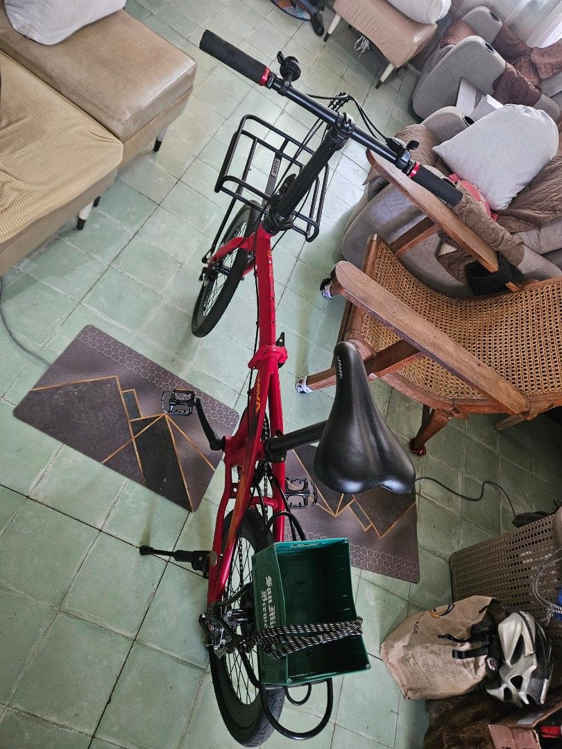 JAVA Red Folding Bicycle with Front and Rear Racks (Category: Bicycles) located in Calamba. Submitted by jingmdejes57879 (Listing ID 1470774309, Image 2). Description: - Brand/Model: Red JAVA folding bike - Setup: Equipped with a front rack and a iconic green San Miguel crate on the back - Components: Black handlebars, saddle, and wheels with reliable disc brakes - Condition: Fully functional frame folding mechanism, smooth chain/gears, with mino
