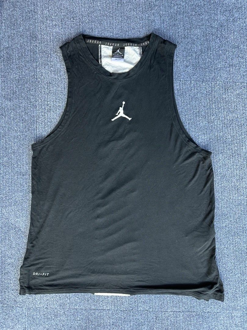 Jordan Air (Category: Activewear) located in Imus. Submitted by alecsssss (Listing ID 1470767745, Image 1). Description: - Brand: Jordan - Color: Black with white accents - Size: Large (L) - Material: Dri-FIT moisture-wicking fabric - Design: White Jumpman logo on front, vertical Jordan lettering on back mesh panel - Fit: Crew neck, sleeveless - Condition: Excellent for workouts and casual wear.