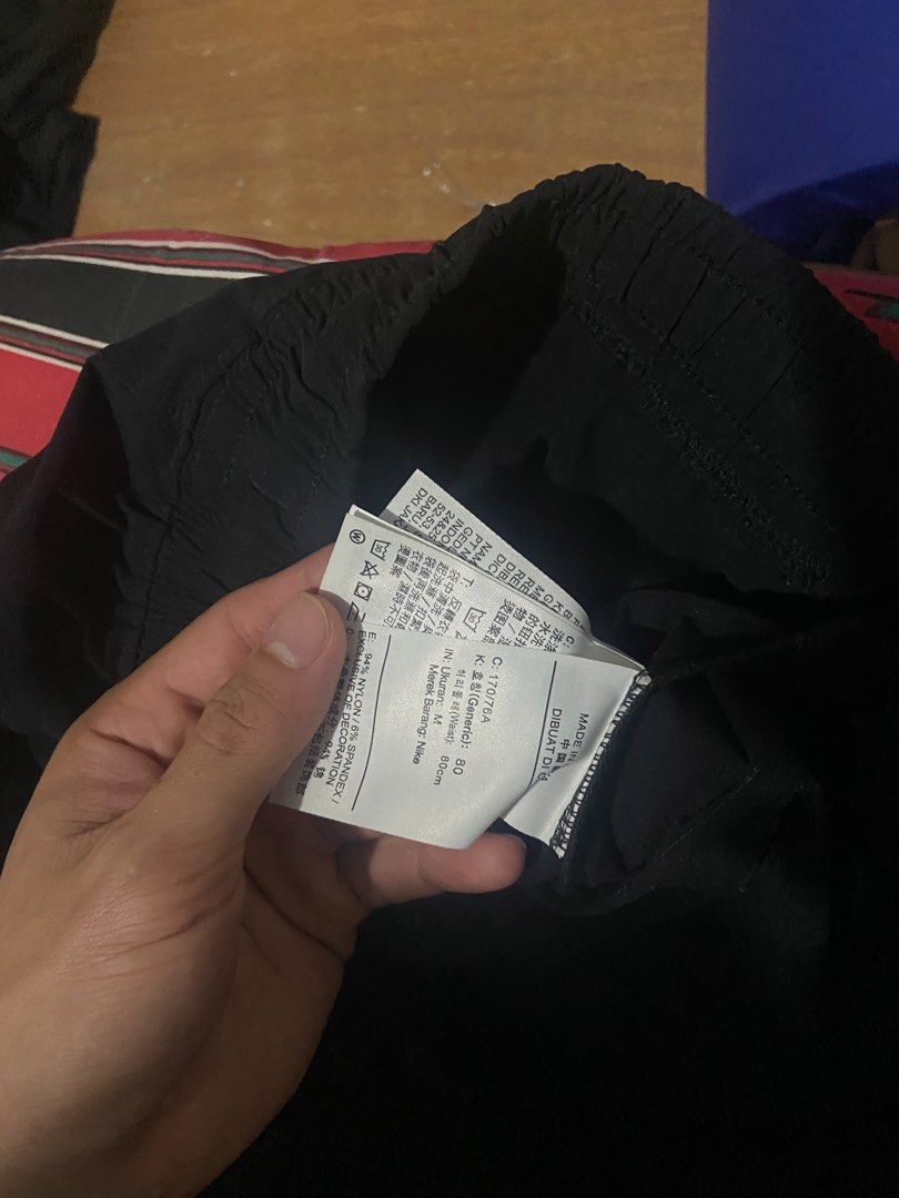 Jordan Black Nylon Pants Size M (Category: Joggers) located in Manila. Submitted by mavcl (Listing ID 1470843568, Image 2). Description: - Brand: Jordan - Color: Black - Size: M (Standard fit) - Material: 94% Nylon, 6% Spandex (lightweight & stretchy) - Waistband: Elastic with clear tag branding - Origin: Made in China - Care: Regular wash instructions on inner tags.
