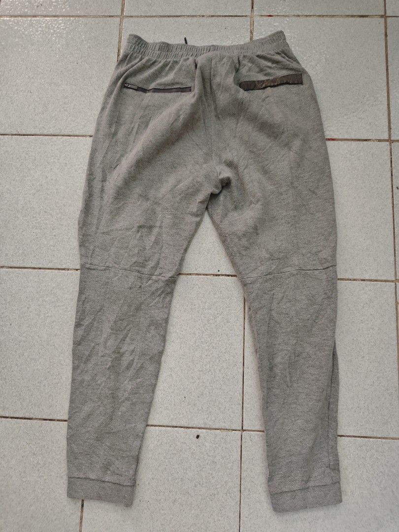 Jordan Grey Sweatpants Joggers Size 34 (Category: Joggers) located in Isulan. Submitted by jaysthrift (Listing ID 1470794976, Image 2). Description: - Brand: Jordan - Color: Grey - Size: Large (34) - Waistband: Elastic with adjustable drawstring - Cuffs: Ribbed at ankles - Pockets: Two front pockets + secure zipper pockets in the back - Logo: Embroidered Jumpman logo on left thigh - Authenticity: Fabric tags attached inside with serial number 724