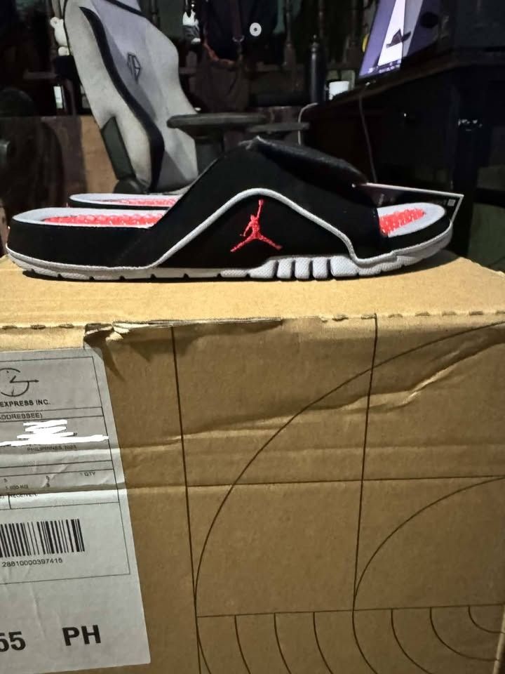 Jordan Hydro Slides Black Red Grey (Category: Slippers & Slides) located in Caloocan City. Submitted by vada920 (Listing ID 1470886092, Image 3). Description: - Brand: Jordan Hydro 4 Retro - Colorway: Black, red, and grey with bright red Jumpman logo - Condition: Brand new with original store tag attached - Features: Adjustable top strap and textured red massaging footbed bubbles - Ideal for: Post-workout recovery and casual everyday lounging - A
