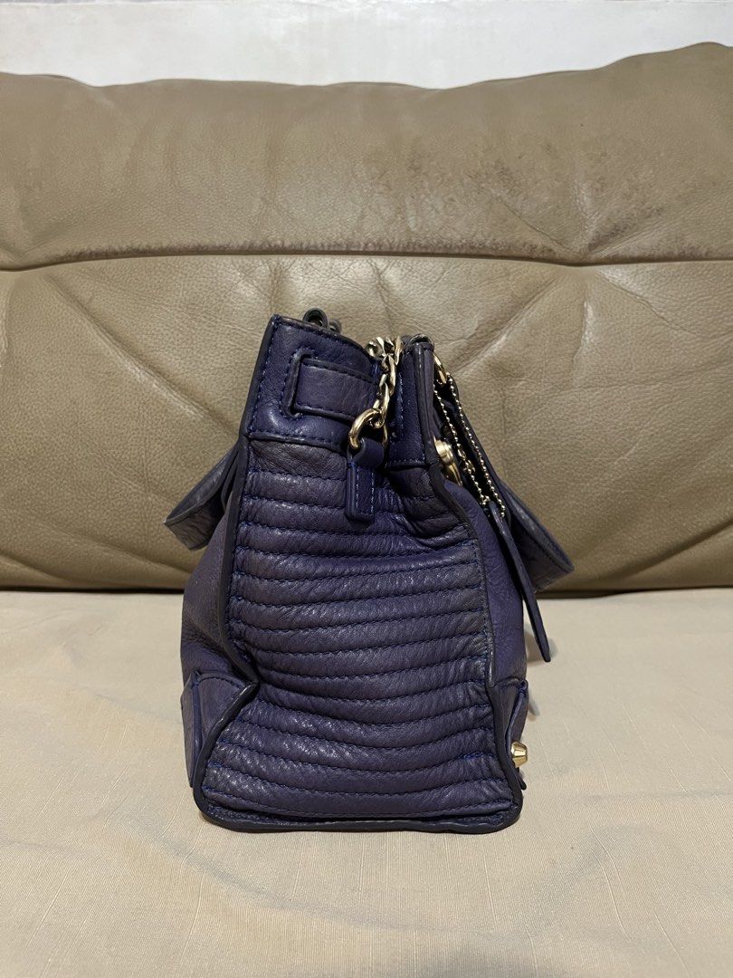 Juicy Couture Leather Satchel (Category: Luxury Bags & Wallets) located in Calamba. Submitted by jupreloved_ (Listing ID 1470793397, Image 3). Description: Juicy Couture deep purple leather satchel bag with gold-tone hardware, heart-shaped lock, studded handles, and leopard print interior lining. Includes dual top handles and an adjustable shoulder strap. Brand: Juicy Couture Size: Small Shipping through J&T. Payment are strictly through GCASH on